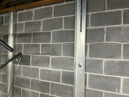 Reinforcement of partial subterranean wall in garage