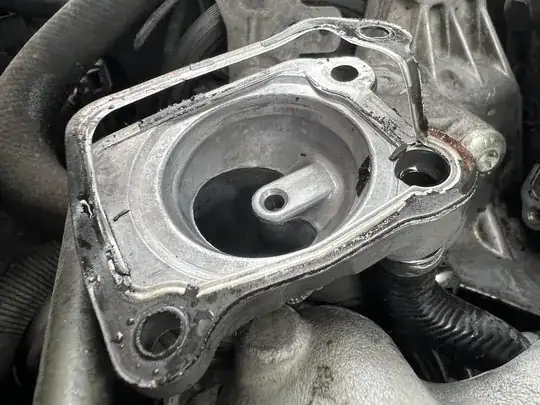 upper thermostat housing with bent gasket