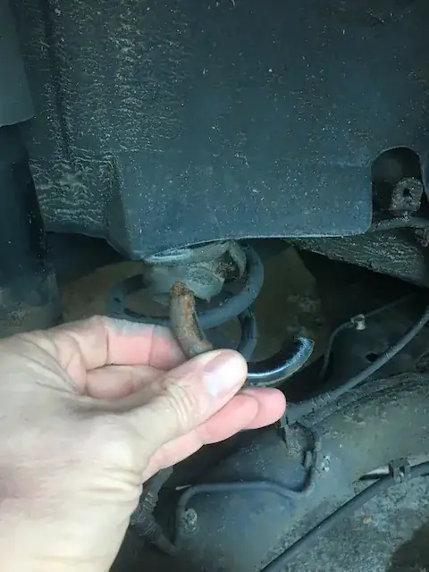 Piece that broke off of the top of the spring