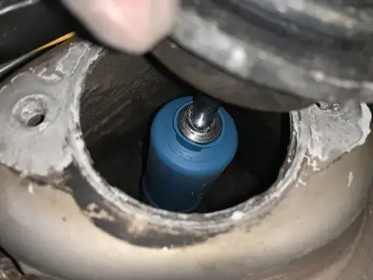 Broken upper mount washer