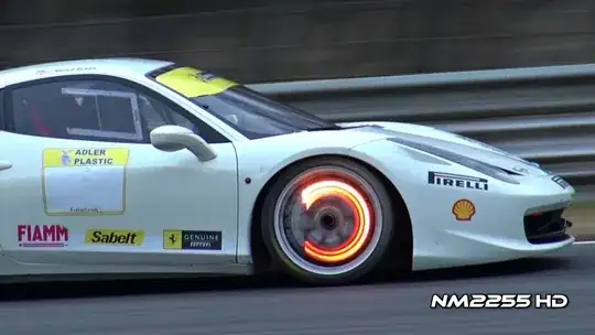 Race car with brakes glowing cause they're wicked hot