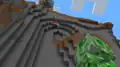 Ari trying to land a hit on a creeper with a mace.