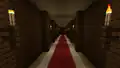 A long corridor inside a woodland mansion.