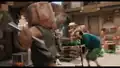 A battle between two characters, while others flee.