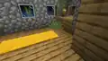 Short grass that generated inside a village house.