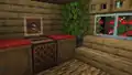 A screenshot of a framed Lava Chicken music disc, hung above a jukebox that's playing the song.