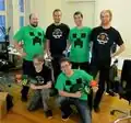Mojang's employees, in their Minecraft suits.
