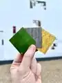 An image of three magnets about to be placed upon the block.
