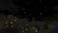 Fireflies glimmering in the dark.
