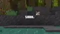 A teaser featuring the bogged peeking above mud.