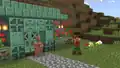 A copper golem in front of an oxidized copper house.