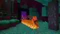 Ari walking out of a Nether portal through a warped forest while leaving a trail of fire behind them.