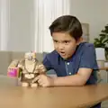 A child playing with a Great Hog action figure.