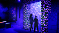 Attendees walking through a nether portal.