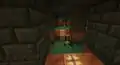 A trap featuring a dispenser and two tripwires.