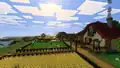 A player-made wheat and carrot farm, with homes next to it. Kai, Sunny, and Zuri are standing in the farm (ordered left to right).