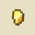 Gold nugget on a plain background.
