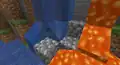 A lava spring flowing onto a river, thus naturally generating cobblestone.