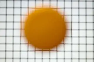 Photo 1: Yellow plastic cap in front of screen, focus behind screen