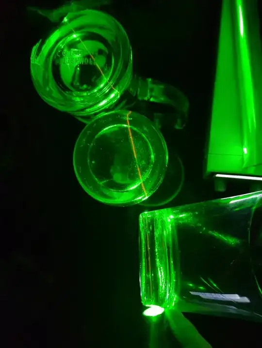 Laser cast through, in that order of transmission, the bottom of a whiskey tumbler, which actually used to be a glass candle, the bottom of a white beer glass and the bottom of a tall pilsner glass. The beam path is visible in red!