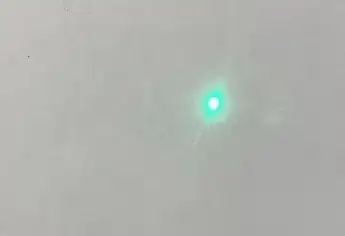 Laser spot on light coloured surface