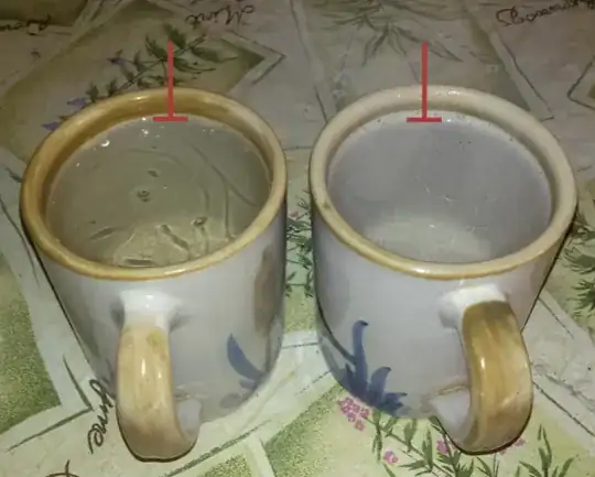 Two mugs of hot water, left one with layer of oil