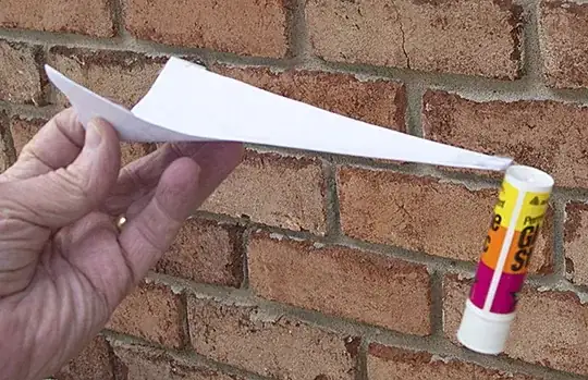 Illustration of double curvature strength: A piece of paper shaped like a pizza slice supports a cantilever load when it's forced to bend in double curvature. (Photo by John Lienhard)