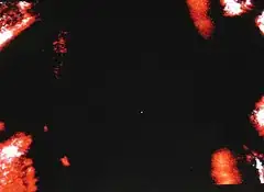 Single trapped atom, glowing blue