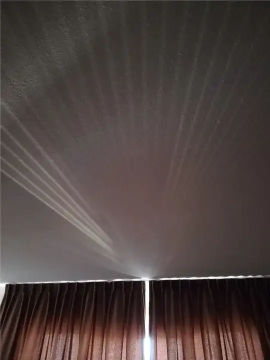 When I look at my curtains in the morning I see this light pattern.