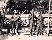 Philippines. Bagabo musicians exhibited at the Louisiana Purchase Exposition in St. Louis, 1904. The girls hold tube zithers [possibly saluray], and the man holds a kutiyapi lute.
