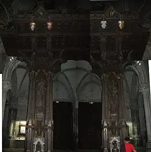 Armorial and ornate support for the organ in the Church of Saint-Léon-IX.