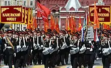Russian drummers with historical units marching behind them