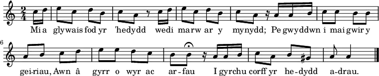 \relative c'' { \time 2/4 \key a \minor \tempo 4 = 60 \set Score.tempoHideNote = ##t
\partial 16*2 c16 d16          % 0
e8 c d b                       % 1
c a r8 c16 d16                 % 2
e8 c d b                       % 3
c a r16 a16 a b                % 4
c8 c b b                       % 5
a b c d                        % 6
e e d c                        % 7
b b\fermata r16 a16 a b        % 8
c8 a  b gis                    % 9
a a4 \bar "|."                 % 10
} \addlyrics {
Mi a gly -- wais fod yr 'he -- dydd we -- di ma -- rw ar y my -- nydd;
Pe gwy -- ddwn i mai gwir y gei -- riau,
Awn â gyrr o wyr ac ar -- fau
I gyr -- chu corff yr he -- dydd a -- drau.
}