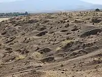 November 4, 2022. An area before the tell shows numerous pits.