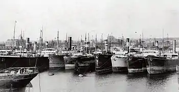Ships moored, ready to load coal (1910)