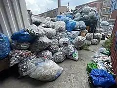 Bottles and cans are sorted and stored throughout the facility.