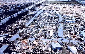An aerial view of destroyed mobile homes with copious amounts of debris