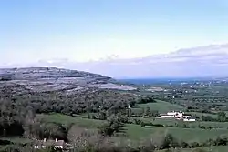 Gregan's Castle Hotel (mid-foreground) and the valley to Ballyvaughan from Corkscrew Hill, the Burren. The hill of the left (west) is Cappanawalla.