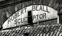 Painted sign, with the words: "Robert Beall Sculptor".