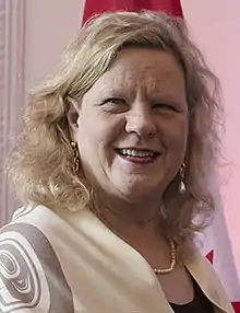 Photograph of Charette smiling.