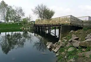 Image 9A wooden bridge leads to the entrance to the Khomutovska Steppe in Donetsk Oblast.