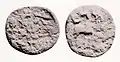 Copper coin of the Tarim Basin, area of Hotan, 1st-2nd century CE.Obv:: Chinese characters: LUH (ε
) TCHU TSIEN "Six tchu (of) money"Rev:: Depiction of a horse. Prakrit legend in Kharoshthi script: GUGRAMAYA.