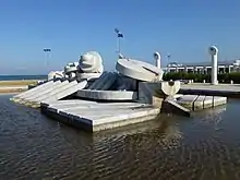 an assemblage of massive blocks surrounded by water