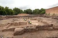 MOLA archaeologists expose the surviving walls of Sayes Court. Image looking west.