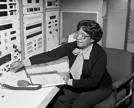 Mary Jackson sitting, adjusting a control on an instrument