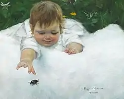 A little girl catching a beetle on the white quilt'