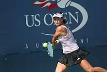 Peng Shuai on the court hitting a tennis ball at the 2010 US Open
