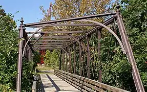 Bridge on the Works site, crossing French Creek (once carrying a spur from the Pickering Valley Railroad), constructed with Phoenix columns.40°08′08.4″N 75°31′03″W / 40.135667°N 75.51750°W / 40.135667; -75.51750 (Phoenix Column Truss Bridge)