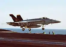 NK-200, the CAG Bird of VFA-115, launch from the USS Abraham Lincoln (CVN-72) on 9 October 2002.