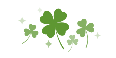 Illustration of several three leaf shamrocks and one four leaf clover in the middle.